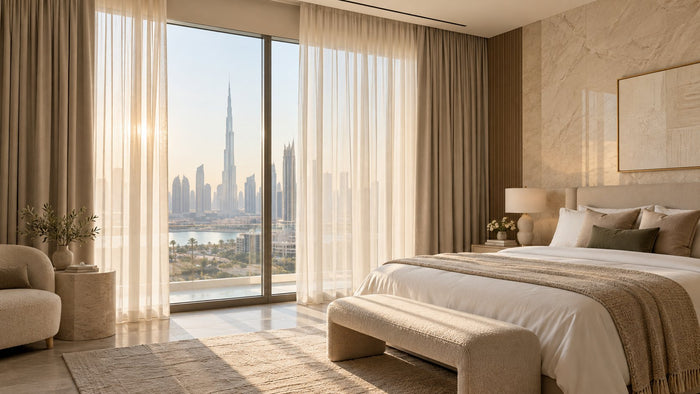 Floor-to-ceiling sheer and blackout curtains in a modern Dubai bedroom